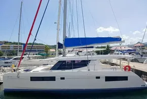 2019 Leopard 45 catamaran docked at marina, featuring blue sail cover.