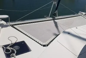 Leopard 48 catamaran 2017 model, front deck with netting and seating area.