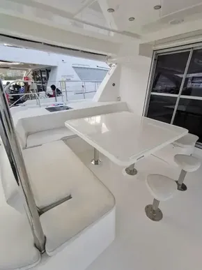2017 Leopard 51 Powercat yacht with outdoor seating and dining area.