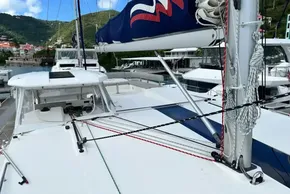 2021 Leopard 50 catamaran docked, showcasing deck and rigging with scenic marina backdrop.