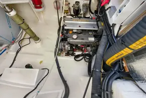 Engine room of 2021 Leopard 50 yacht with Yanmar engine and various cables.