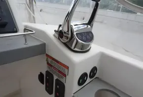 Control panel of a 2020 Leopard 43 Powercat boat with throttle and switches.
