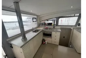 Modern kitchen interior of 2020 Leopard 40 catamaran with ocean view.