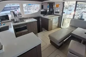 Modern interior of 2022 Leopard 45 yacht with kitchen and seating area.
