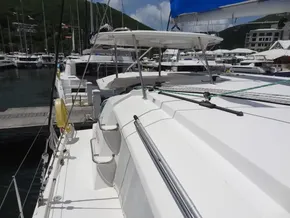 2021 Leopard 40 catamaran docked at marina with scenic mountain backdrop.