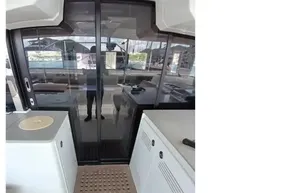 Interior view of 2020 Lagoon 46 yacht with sliding glass doors and modern amenities.
