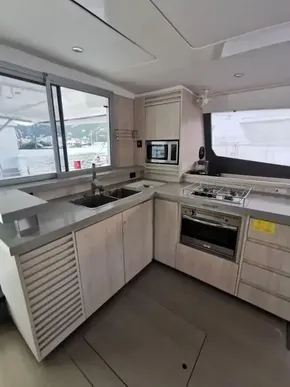 Modern kitchen interior of a 2017 Leopard 51 Powercat yacht with sleek appliances.