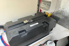 Battery compartment in 2024 Leopard 40 Powercat with secured black casing and wiring.