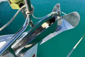 Anchor on Jeanneau Sun Odyssey 389 sailboat, 2020 model, over turquoise water.