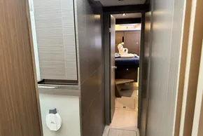 Interior hallway of 2025 Robertson and Caine Leopard 46 Powercat, leading to a cozy bedroom.