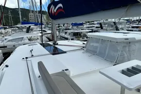 Leopard 50 catamaran, 2021 model, docked in a marina with other boats.