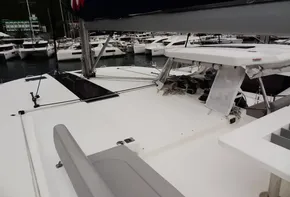 Leopard 50 catamaran, 2020 model, docked at a marina with other boats in the background.