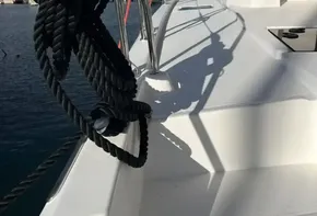 2019 Leopard 45 yacht deck with coiled rope and ocean view.