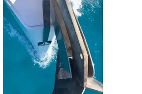 Bow of 2013 Beneteau Oceanis 41 sailing in clear blue water.