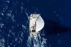 Aerial view of 2025 Leopard 46 yacht sailing on deep blue ocean.