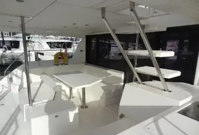 2017 Leopard 43 Powercat yacht interior with dining area and staircase.