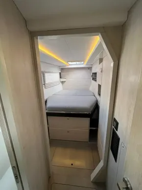 2019 Leopard 45 yacht interior cabin with modern design and cozy bed.