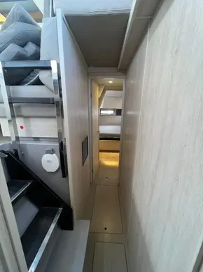 Narrow hallway inside 2019 Leopard 45 yacht with modern interior design.