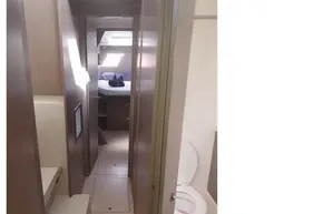 Interior of 2022 Leopard 45 yacht, featuring hallway, bedroom, and bathroom.