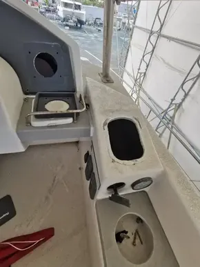 2017 Leopard 43 Powercat boat interior with control panel and storage compartments.