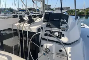Sailing yacht cockpit of 2021 Leopard 45 with steering wheel and navigation instruments.