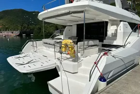 2022 Leopard 53 Powercat yacht docked, featuring spacious deck and modern design.