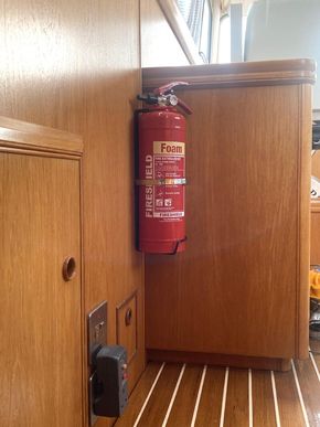Fire safety - 2kg extinguisher, saloon, at top of steps from aft cabin