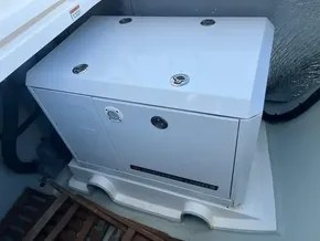 White generator in a 2019 Leopard 45 yacht engine room.