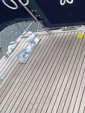 Heavy duty deck cleat and fairleads, aft, port quarter, emergency steering access visible to the right of the image