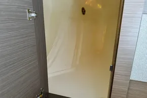 Open cabinet door on 2025 Robertson and Caine Leopard 46 Powercat yacht interior.