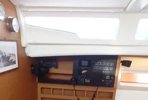Interior of 2019 Jeanneau Sun Odyssey 440 sailboat with navigation equipment and seating area.
