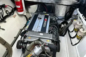 Engine room of 2022 Leopard 53 Powercat with Yanmar engine and fire extinguisher.