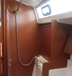 2019 Beneteau Oceanis 41.1 yacht bathroom with wooden interior and shower.
