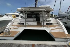 2019 Leopard 45 catamaran docked at marina, rear view.