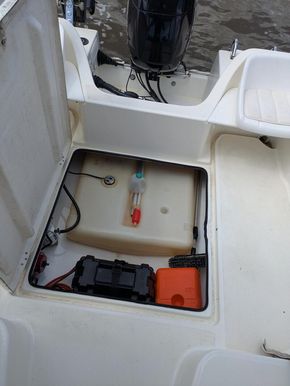 The fuel tank and twin batteries with the hatch open