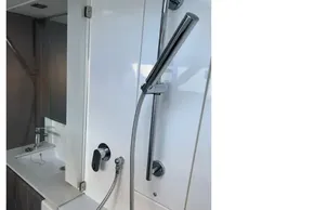 Modern bathroom in 2022 Leopard 42 yacht with sleek shower and sink design.