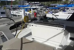 Beneteau Oceanis 46.1 2020 model docked at marina, cockpit view with seating and equipment.