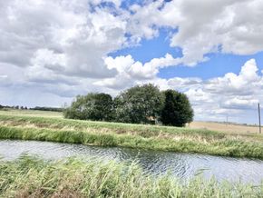 Across the other side of the river