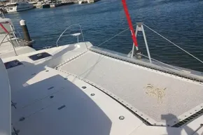 2022 Leopard 45 catamaran deck with netting, docked at marina.