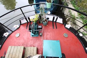 bow section of boat with winch and front hatch