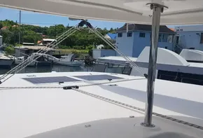 Leopard 48 catamaran docked at marina, showcasing solar panels on deck.
