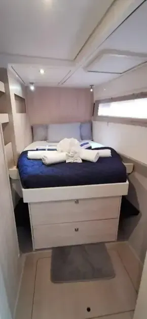 2019 Leopard 51 Powercat bedroom with neatly made bed and modern interior design.