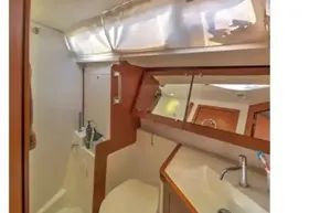 2013 Beneteau Oceanis 41 bathroom with modern fixtures and natural lighting.