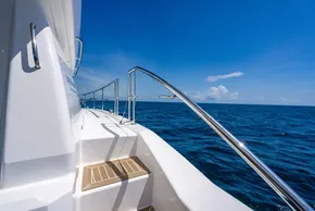 2025 Leopard 40 Powercat yacht on open sea under clear blue sky.