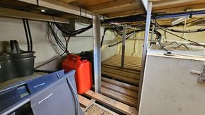 Engine room of 2016 Custom Replica Dutch Barge Peniche 45 with cables and equipment.