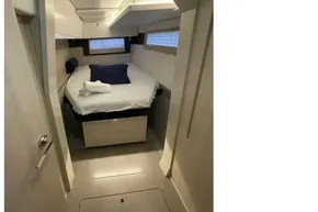 2020 Leopard 40 yacht cabin with cozy bed, modern design, and natural light.