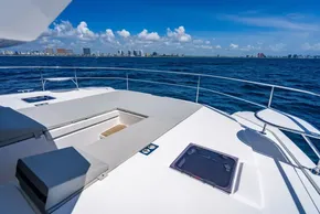 2025 Leopard 40 Powercat yacht deck with ocean view and city skyline in background.