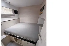 Modern interior cabin of 2019 Leopard 50 yacht with bed and storage.