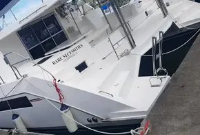 2017 Leopard 48 catamaran named Bare Necessities docked at a marina.
