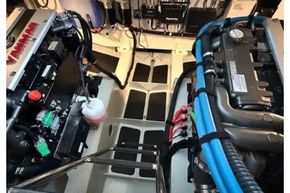 Engine room of 2025 Linssen 45 SL Sedan yacht, showcasing advanced machinery and wiring.